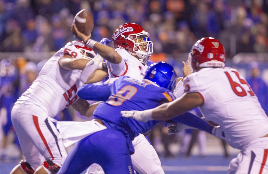 Boise State linebacker Jabril Frazier (8) pressures Fresno State quarterback Marcus McMaryion (6) during the Bulldogs’ 24-17 loss to the Broncos at Albertsons Stadium Friday, Nov. 9, 2018. McMaryion has completed 70.6 percent of his passes this season, the highest percentage in the Mountain West Conference.