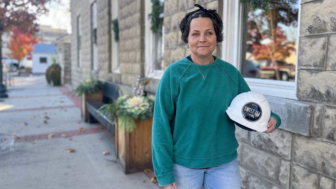 Megan Hoiosen stands outside her business, Sweet Tea Living, in downtown Eagle. Hoiosen fashioned herself a hard hat for weekly "road report" videos she's been posting on Instagram for the past two years that the roads around her shop have experienced closures.