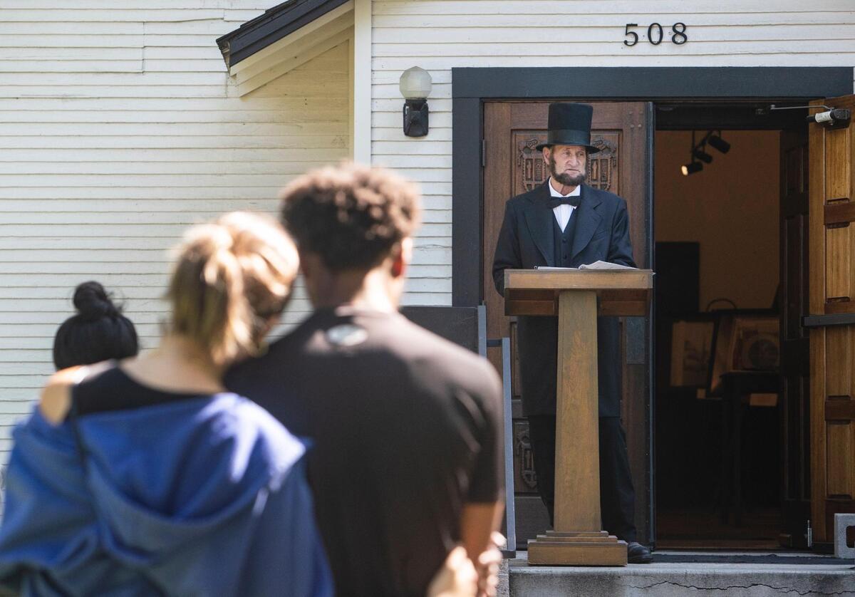 Attendees listen as Abraham Lincoln presenter Skip Critell of Boise gives a history of Lincoln, the Civil Rights movement, and recollections of his personal life as a child living in the South, during Idaho’s first celebration of Juneteenth as a federal and state holiday in 2021. Several offices will be closed on Friday, June 19, in observance of the holiday.