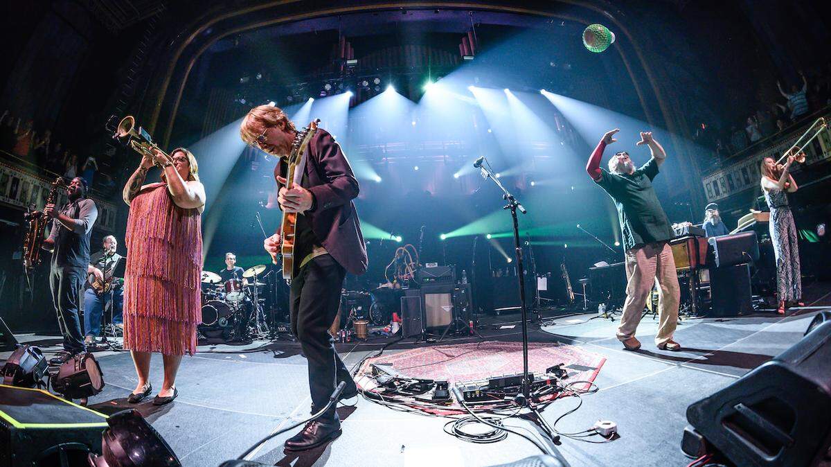 Trey Anastasio Band (TAB) typically tours as an eight-piece group with a horn section.