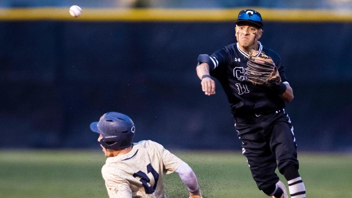 Columbia shortstop Isaiah Capetillo turns a double play last year in the 4A district championship. He is one of seven returning starters for the Wildcats, the preseason favorites in the 4A SIC.