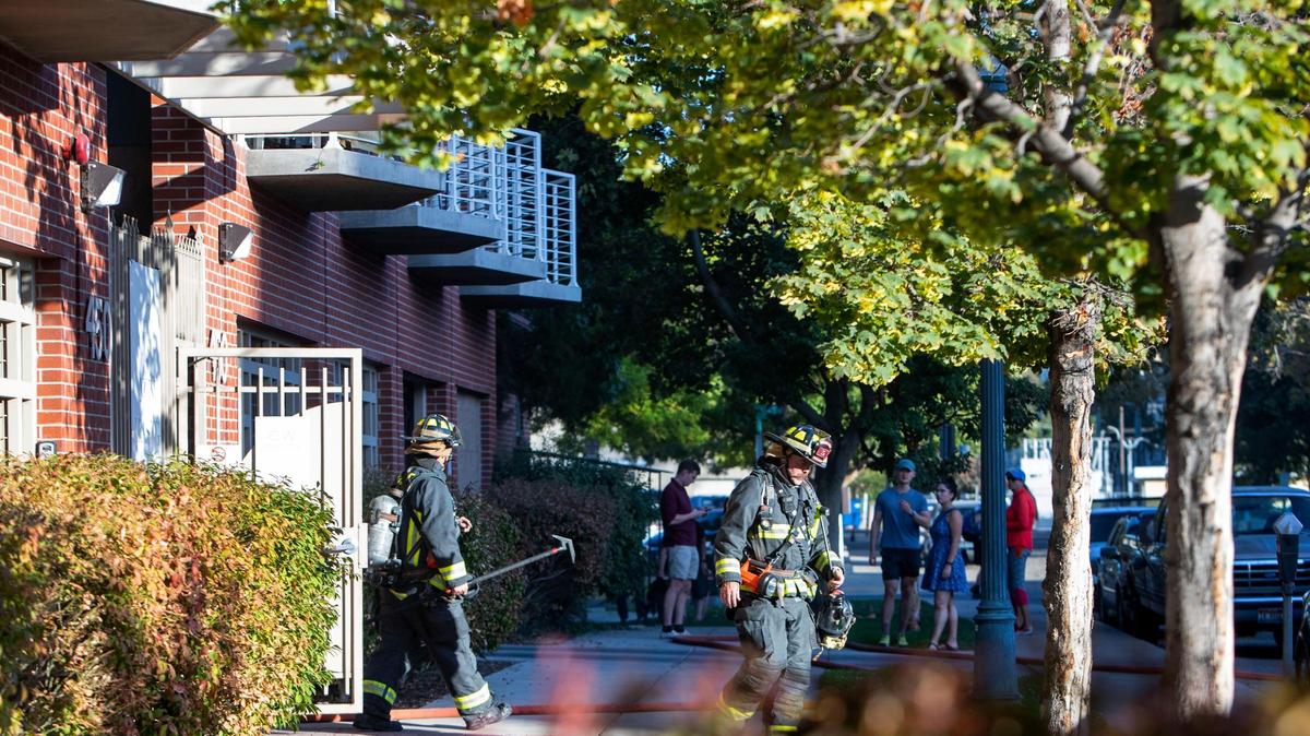 The Boise Fire Department responds to a fire in the first-story garage of the CW Moore Apartments in downtown Boise on Thursday.