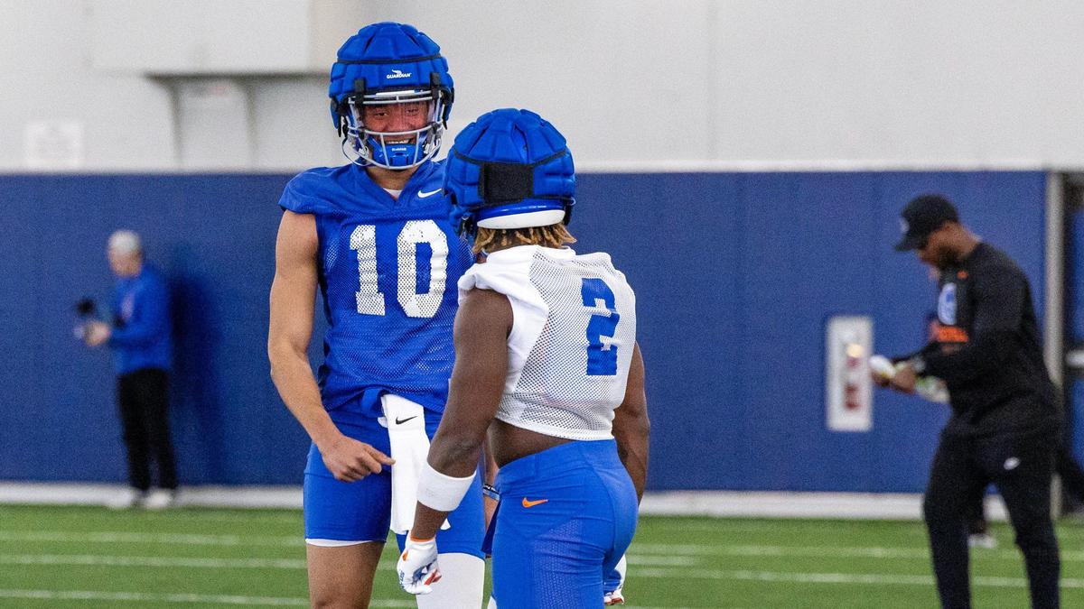 Boise State’s Taylen Green, left, talks with Ashton Jeanty on the practice field at the Caven-Williams Sports Complex at BSU, Thursday, March 2, 2023.