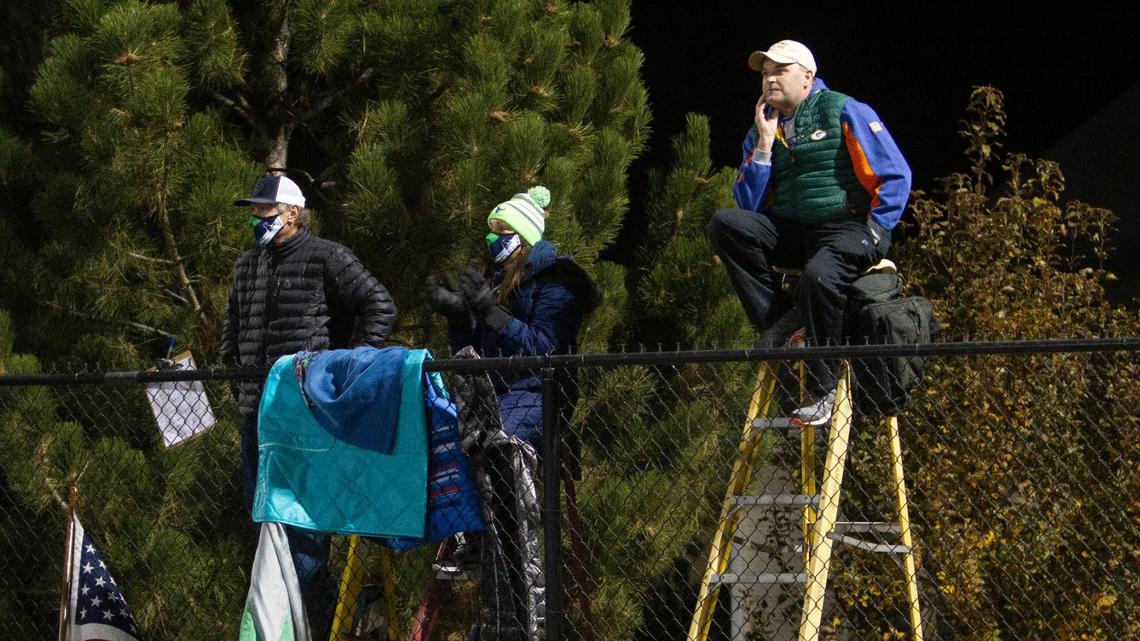 Mountain View High fans got creative to get around the Boise School District’s ban on fans, climbing atop ladders outside the fence at East Junior High for a state quarterfinal against Capital.