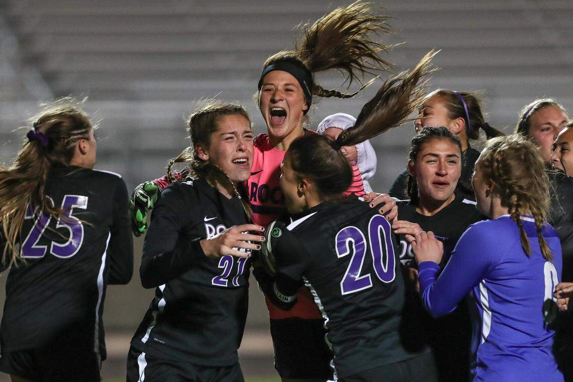 The Rocky Mountain High girls soccer team celebrates after repeating as 5A state championship Saturday over Boise.
