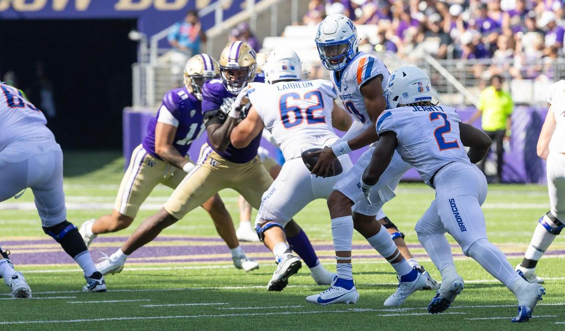 Boise State quarterback Taylen Green passes the ball to Boise State running back Ashton Jeanty in the second quarter of their game against University of Washington at Husky Stadium in Seattle, Saturday, Sept. 2, 2023.