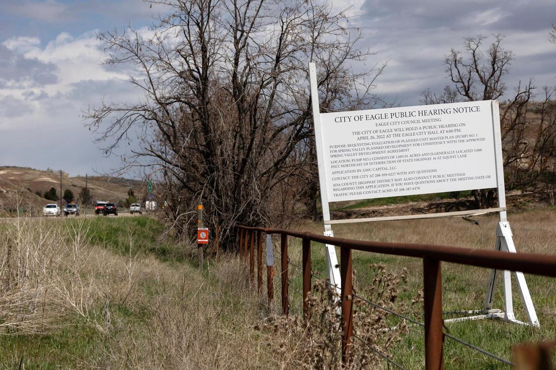 A sign at the northeast intersection of State Highway 16 and Equest Lane announces a public hearing about Spring Valley.