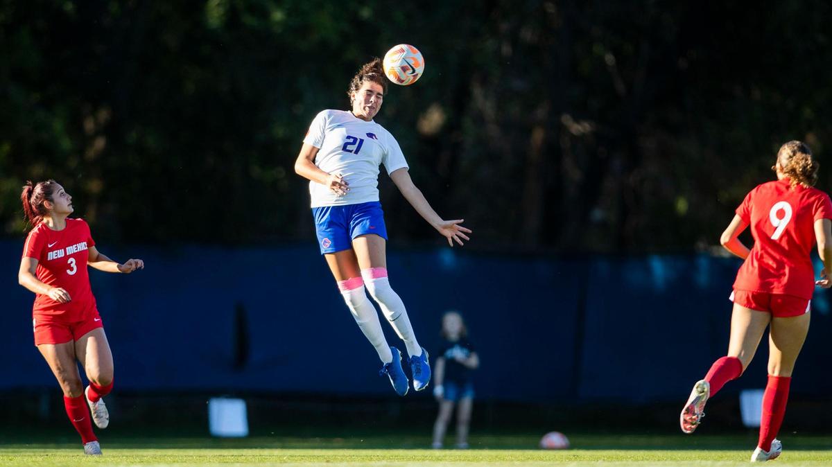 Boise State defender Macie Nelson heads the ball away from New Mexico on Thursday at Boas Soccer Complex in Boise. The fifth-year senior and Borah High graduate played her school-record 87th career match for the Broncos against the Lobos.