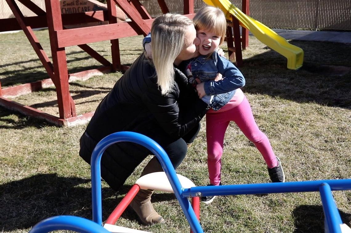 Alisa Memisevic picks up her daughter, Vanessa, 4, from daycare. She considers herself lucky to have found a place for her children while she and her husband work. She can make her hours and the daycare hours work - but she’s been on a waiting list for a year for a place that suits them better.