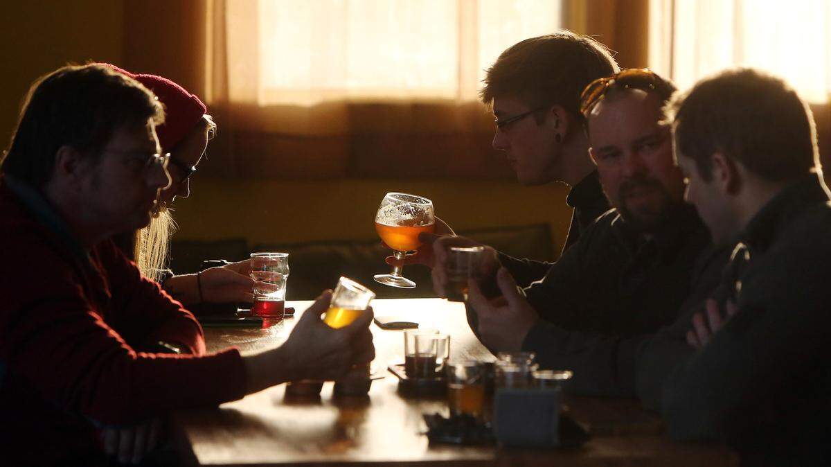 In this file photo, patrons at Woodland Empire Ale Craft enjoy craft beers at the downtown brewery.