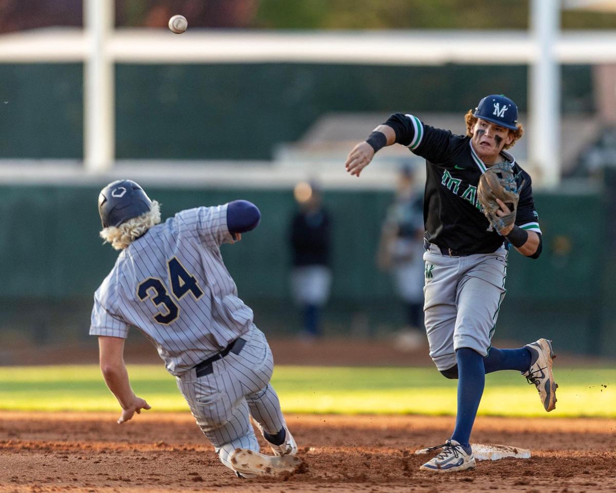 Mountain View second baseman Cooper Schneidt turns a double play before Middleton’s Drew Holman can reach the bag during the 6A state semifinals last season at Memorial Stadium in Garden City. 