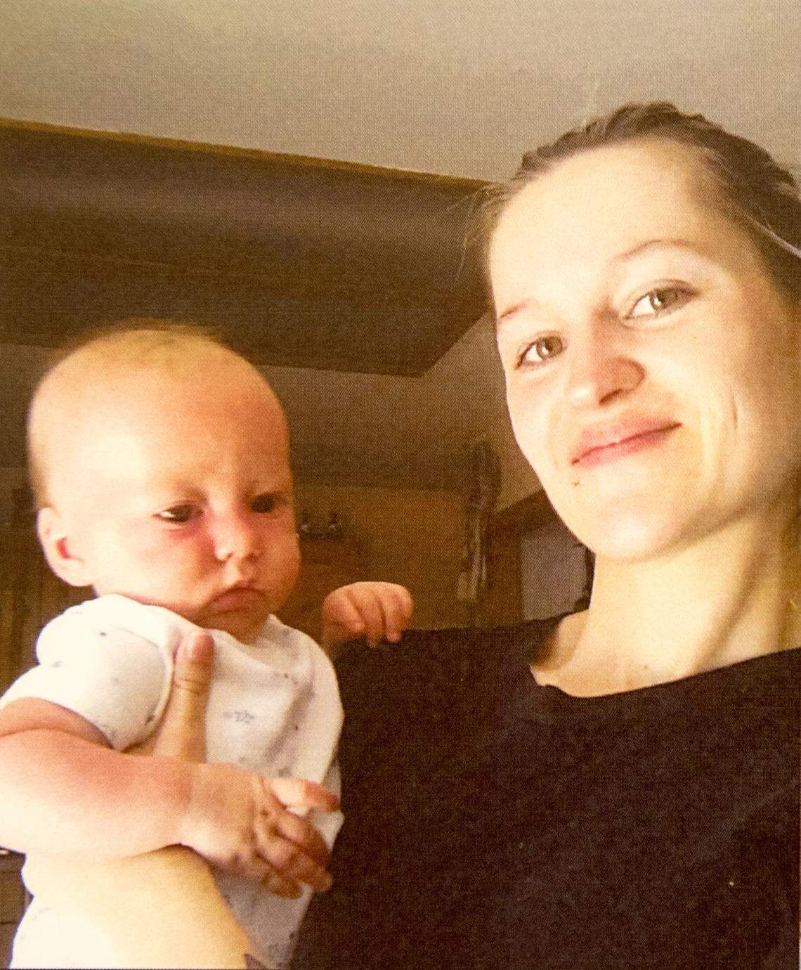 Jaclyn Zabel with one of her children. Zabel was shot to death in late May by her boyfriend, who then killed himself, authorities say.