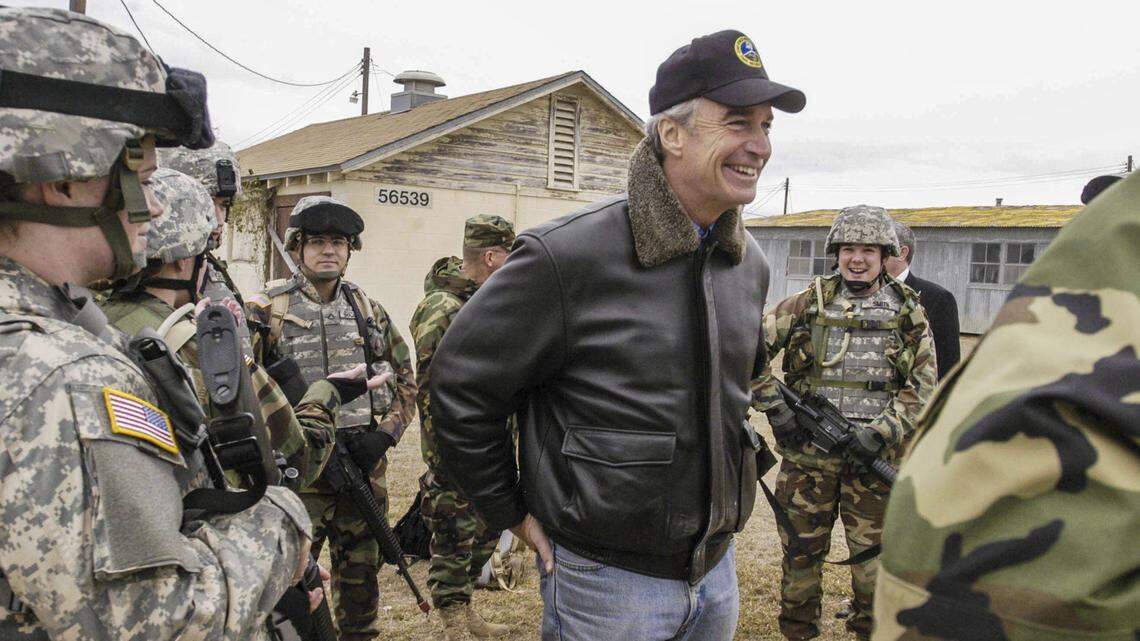 Gov. Dirk Kempthorne, who makes a point to personally greet Idaho troops in training and on active duty, visits the 1-183rd Aviation Battalion at Fort Hood in Texas in 2006. Of the 430 who were deployed to Afghanistan shortly thereafter, 250 are from Idaho.