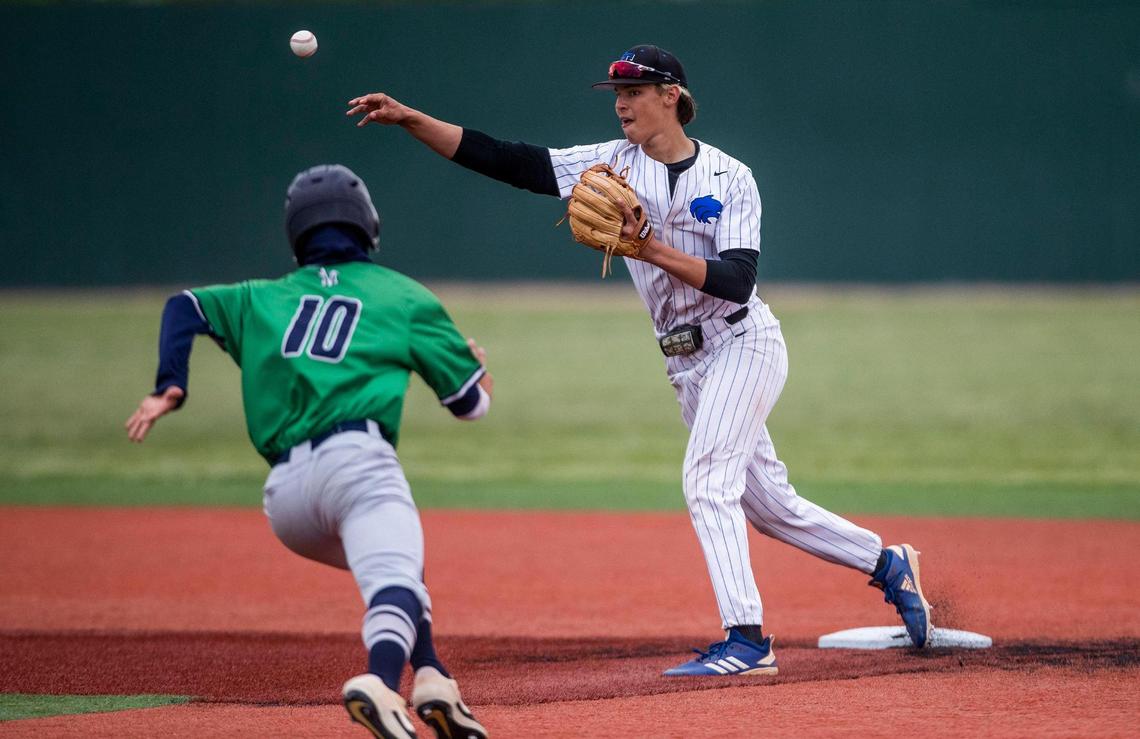 Timberline shortstop Greyson Shafer finishes a double play as Mountain View runner Mason Chiles slides into second base Friday in the semifinals of the 5A state baseball tournament at Wolfe Field in Caldwell.