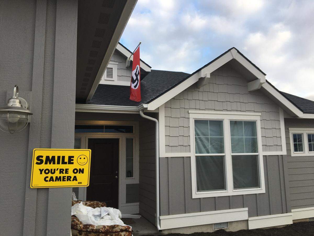 The homeowner of this house in a Caldwell subdivision says the Nazi flags are a protest against the actions of his homeowners association, which he compared to Nazi behavior.