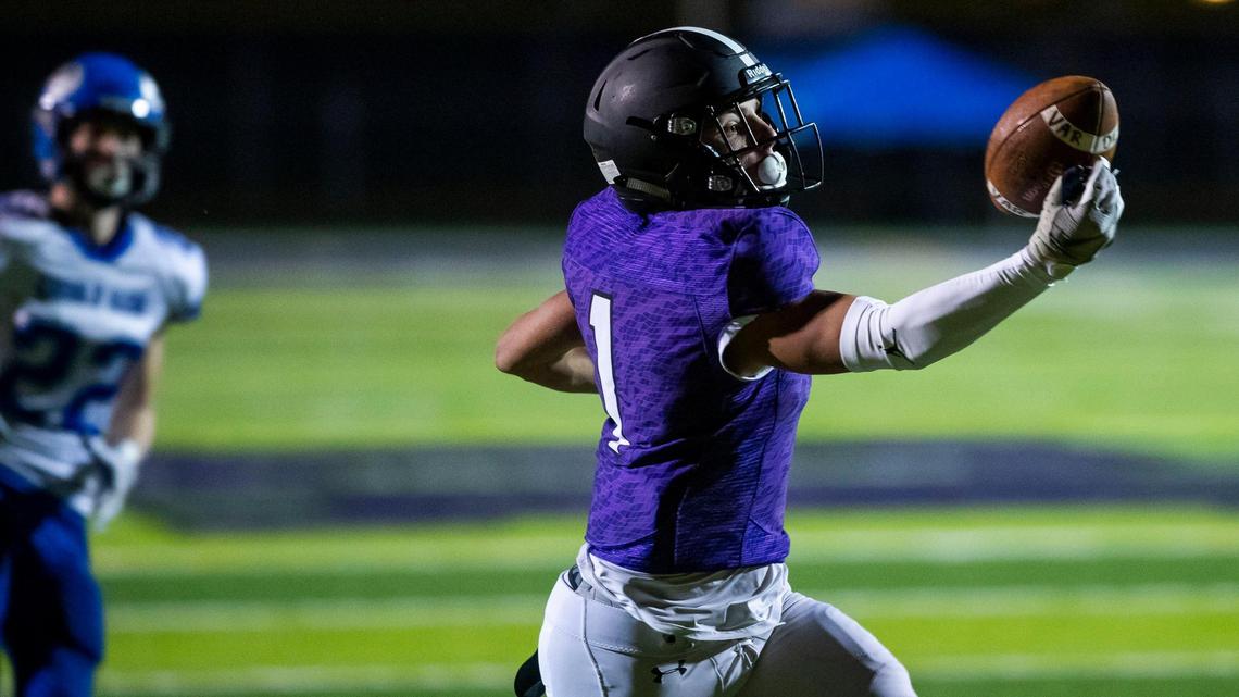 Rocky Mountain’s Jordan Erickson hauls in a one-handed touchdown catch against Coeur d’Alene during last week’s 5A state semifinal.