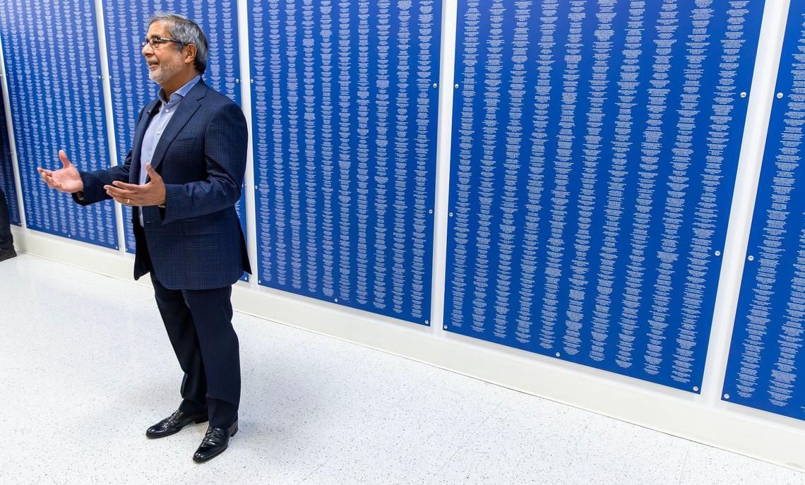 Standing in front of a wall showing over 50,000 patents, Micron Technology CEO Sanjay Mehrotra hosts a tour of the construction of a new $15 billion fab facility in Boise, with U.S. Sen. Mike Crapo and Deputy Secretary of the Treasury Wally Adeyemo, Monday, June 10, 2024.