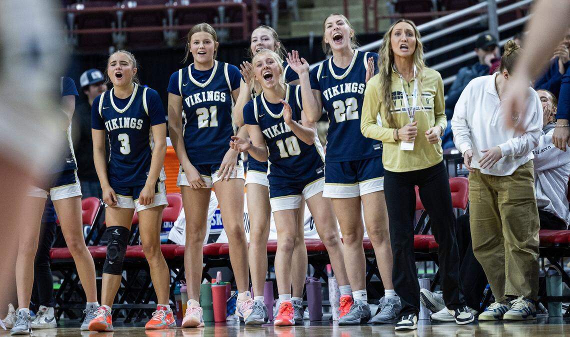 Middleton's bench celebrates teammate Zoey Blackwell getting fouled on a successful 3-pointer for a 4-point play against Rigby in the semifinals of the 6A girls basketball state tournament at Ford Idaho Center in Nampa, Friday, Feb. 20, 2026.