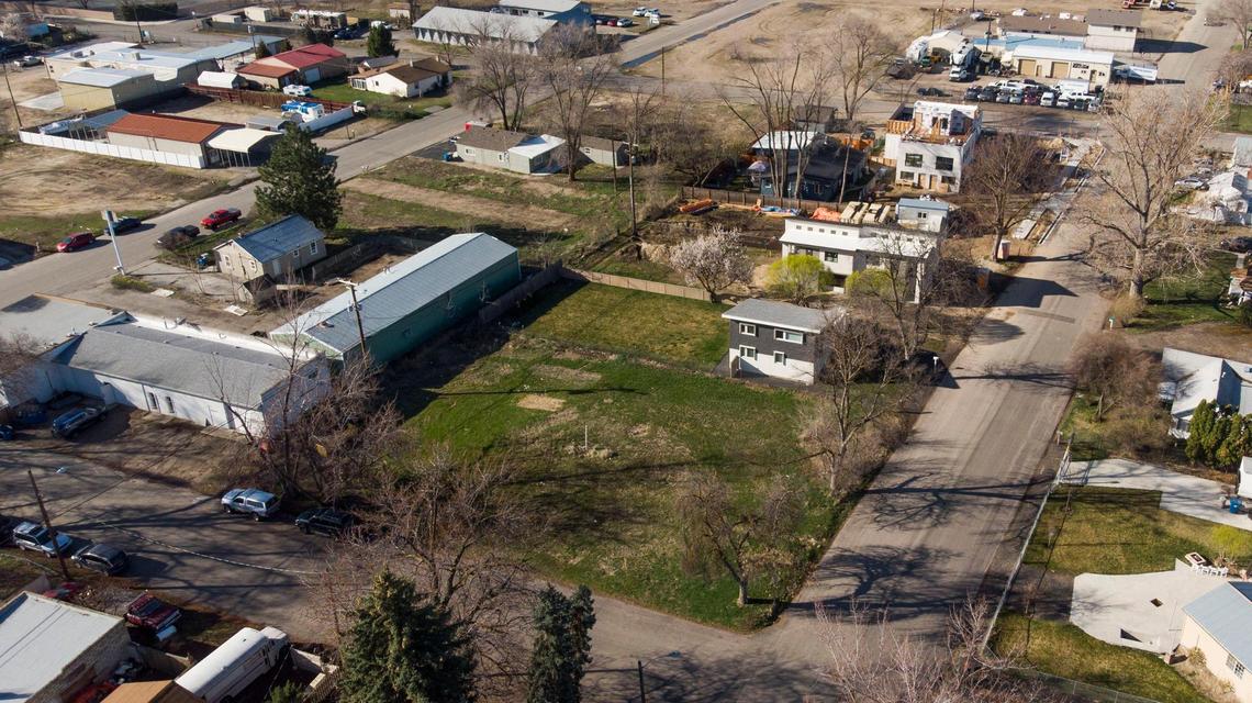 A separate project proposal would build 22 townhouses, with 44 parking spaces and enclosed garages, on this property at 35th and Carr streets near Push & Pour (far left on 34th Street).