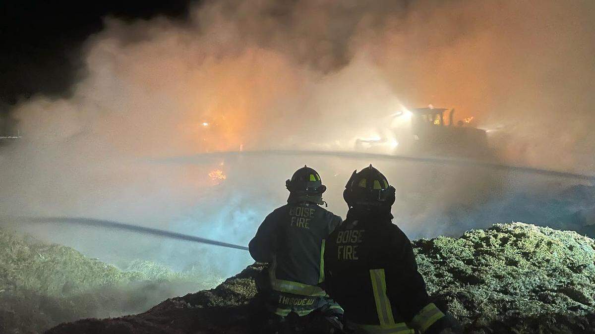 Boise firefighters worked to extinguish flames that burned more than 200 tons of hay Saturday, Oct. 15, 2022, south of West Lake Hazel Road