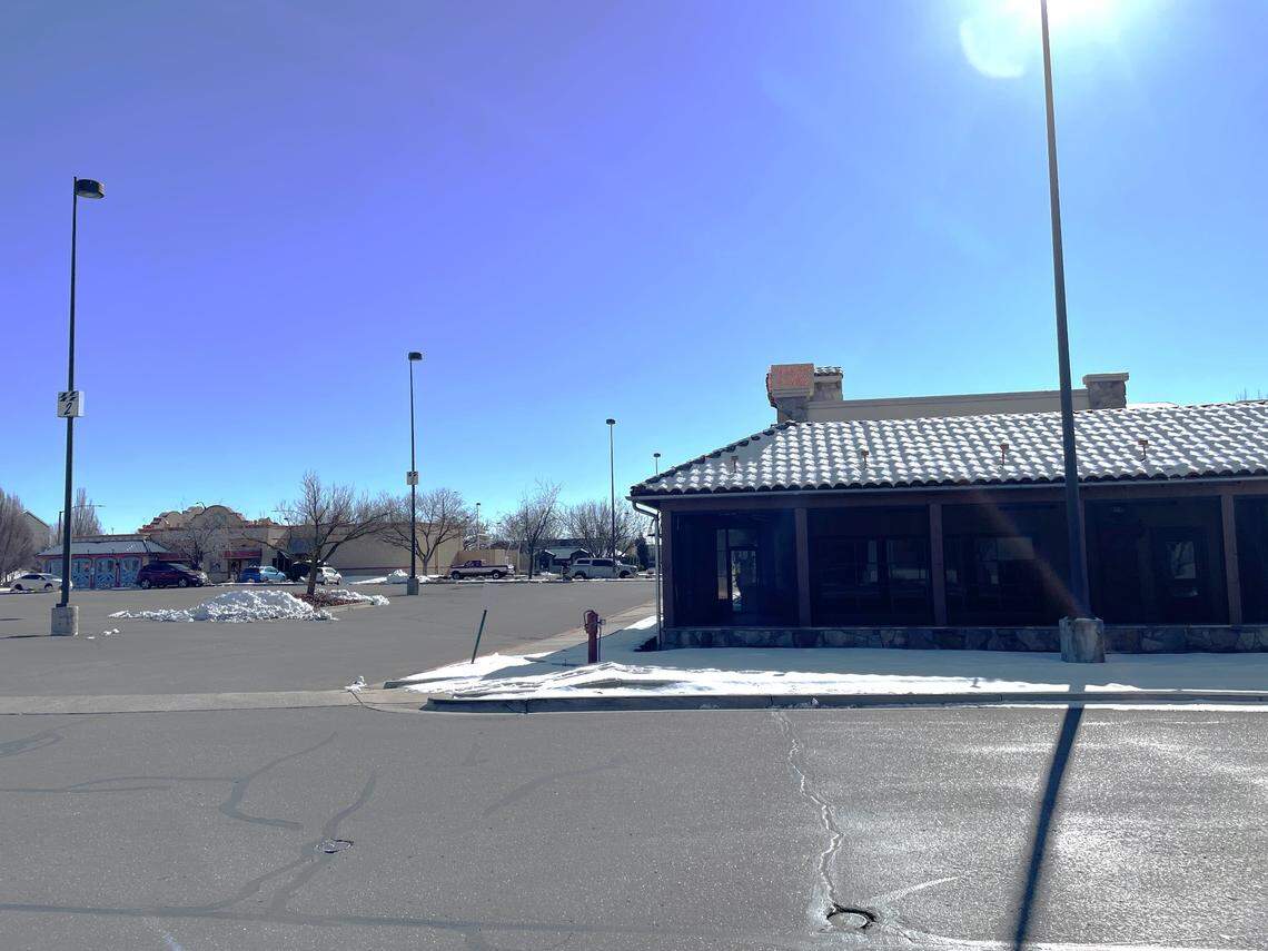 The former Johnny Carino’s restaurant, foreground, and El Tenampa, rear, both would be demolished as part of the plan to build a new Chick-fil-A.