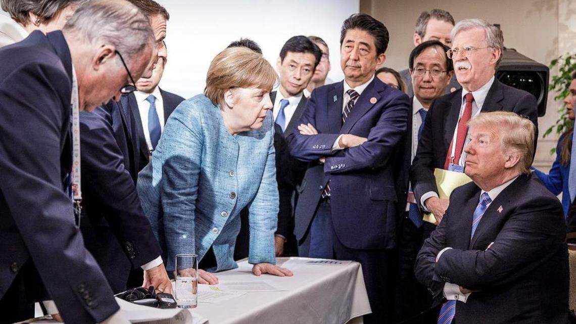 German Chancellor Angela Merkel speaks with President Donald Trump during the Group of 7 summit meeting in La Malbaie, Quebec, Canada, June 9, 2018. The photo quickly went viral after it was shared on Merkel’s Instagram account.