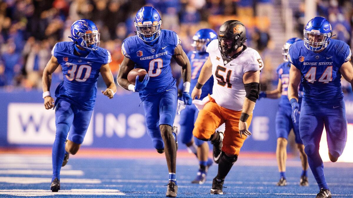 Late in the fourth quarter, Boise State safety JL Skinner runs for a touchdown after recovering a fumble on a play that was ultimately ruled dead. The ball was placed at the spot of the fumble.