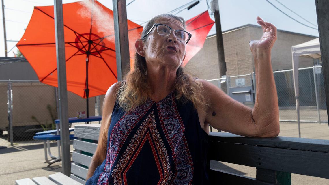 As outdoor temperatures top 100 degrees, Debra Thornton sits comfortably at the cooling station provided for guests at Corpus Christi House in Boise.