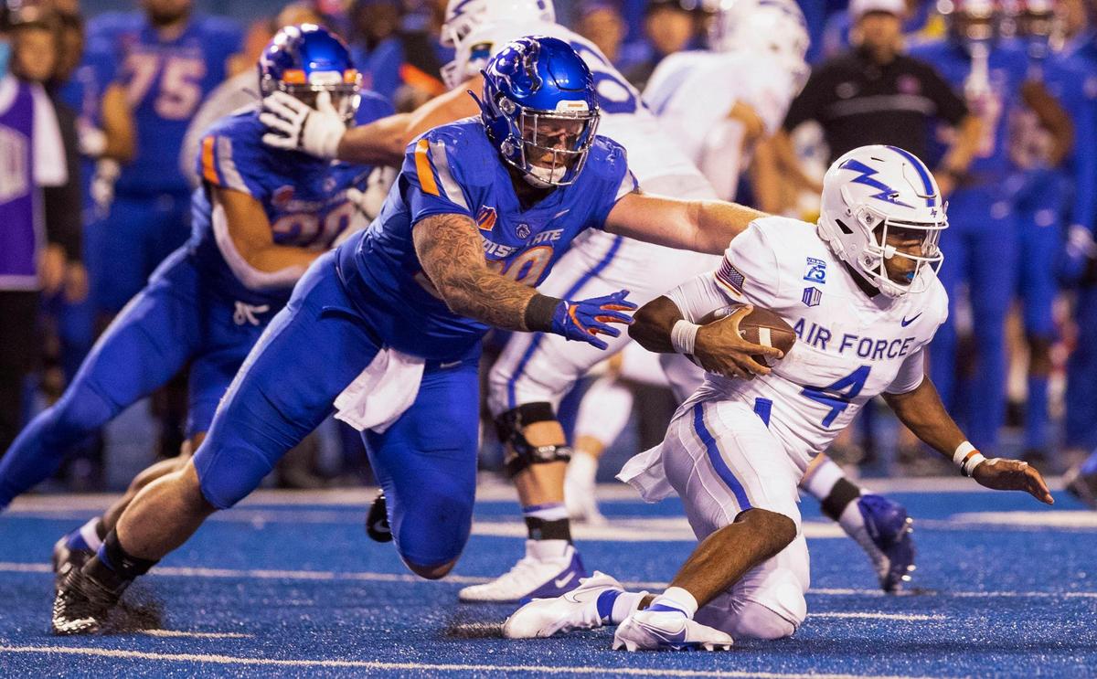 Boise State defensive tackle Scott Matlock tackles Air Force quarterback Haaziq Daniels for no gain during the first half of the game Saturday, Oct. 16, 2021 at Albertsons Stadium.