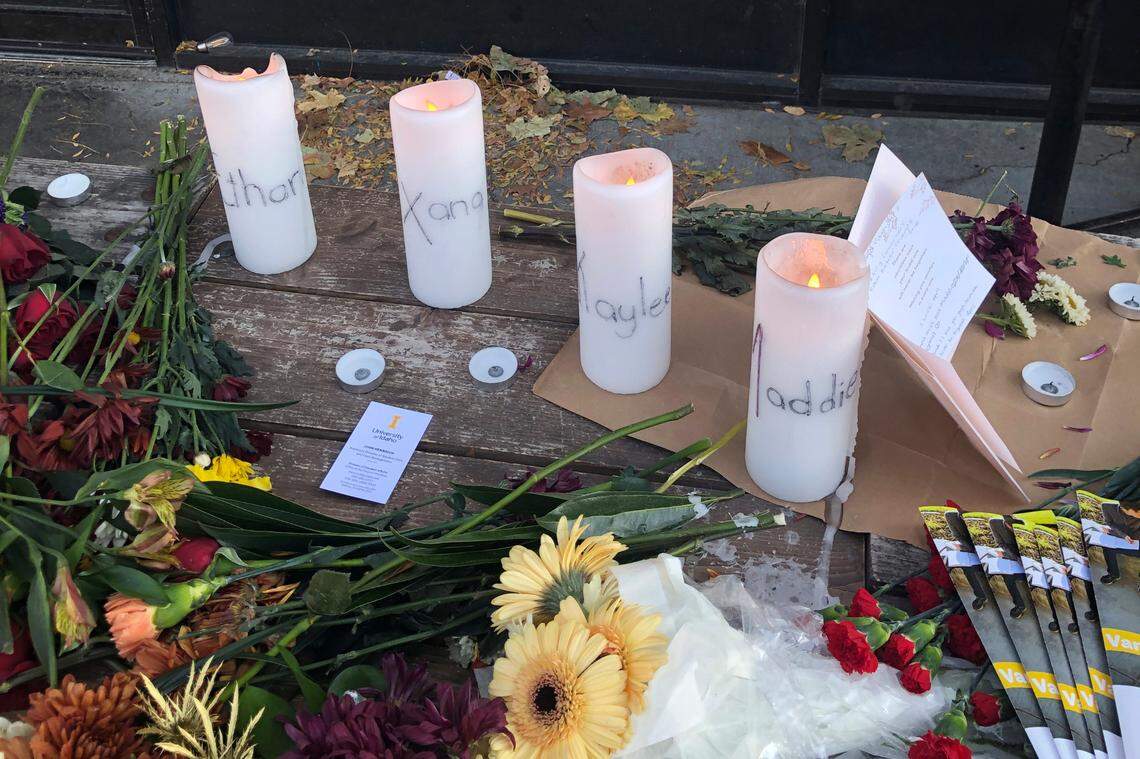 Candles and flowers formed a memorial outside a downtown Moscow business that honored the four University of Idaho students killed in November 2022. Defendant Bryan Kohberger’s murder trial is scheduled for summer 2025.