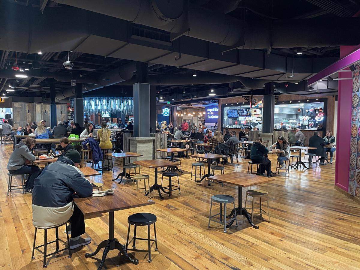 In this file photo, diners enjoy a vibrant atmosphere on a weeknight at The Warehouse Food Hall in downtown Boise.