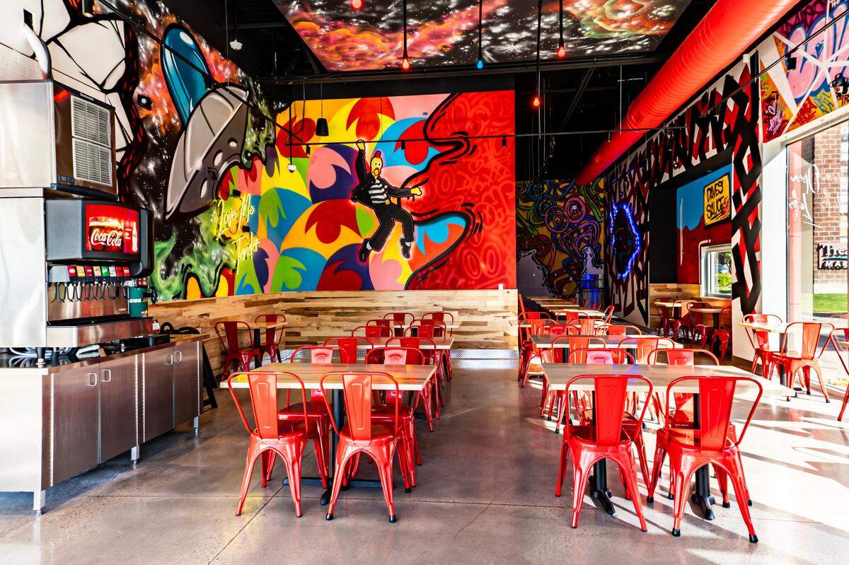 The new restaurant includes a colorful, street-art vibe.