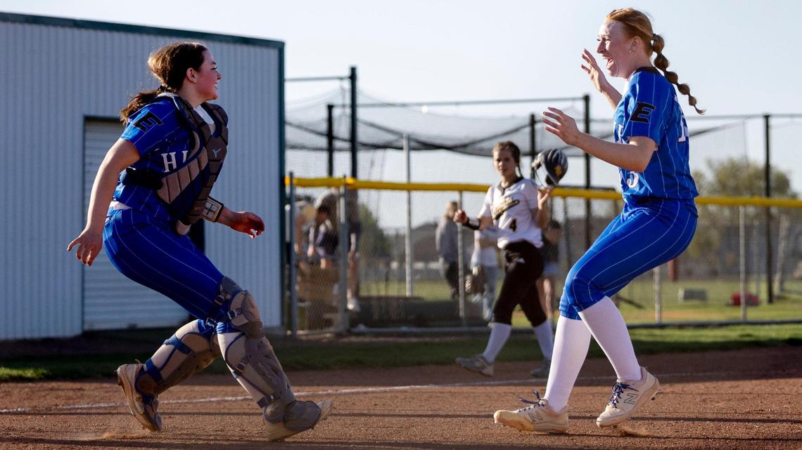 Emmett pitcher Karadyn Fuller and catcher Raegyn Dupree celebrate the Huskies’ 7-4 win over Bishop Kelly in the 4A District Three championship game at Vallivue High School.