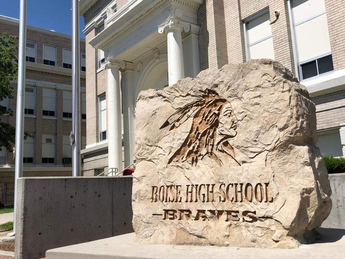 A rock marking Boise High School as home of the Braves stands in front of the school.