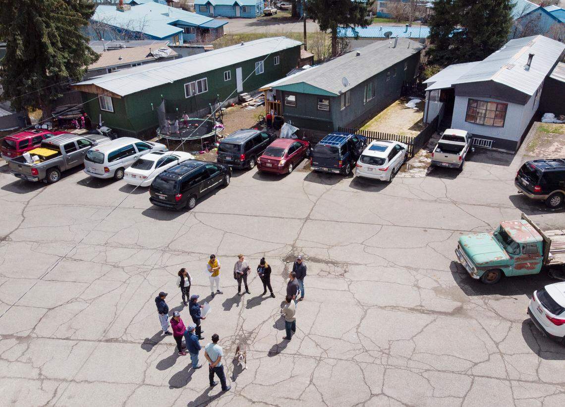 Residents of J&J Trailer Park, located two miles south of Ketchum city limits, meet in the parking lot with representatives from charity Neighbors Helping Neighbors on Sunday, May 1.