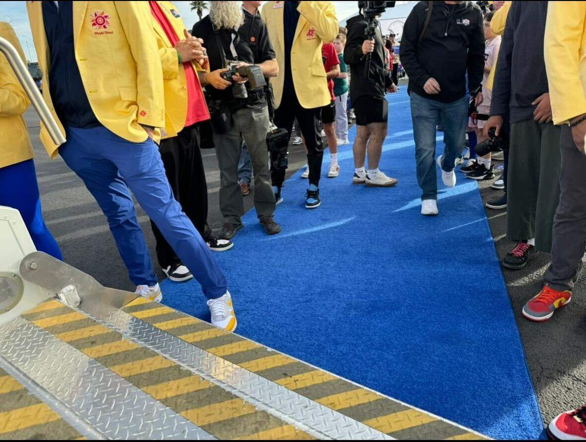 The blue carpet, surrounded by Fiesta Bowl committee members in their yellow jackets, that was rolled out for the Broncos’ arrival in Phoenix.