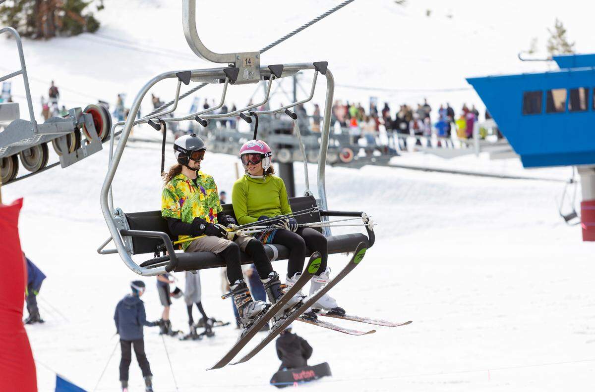 People ski and snowboard on the last day of the season at Bogus Basin on April 3.