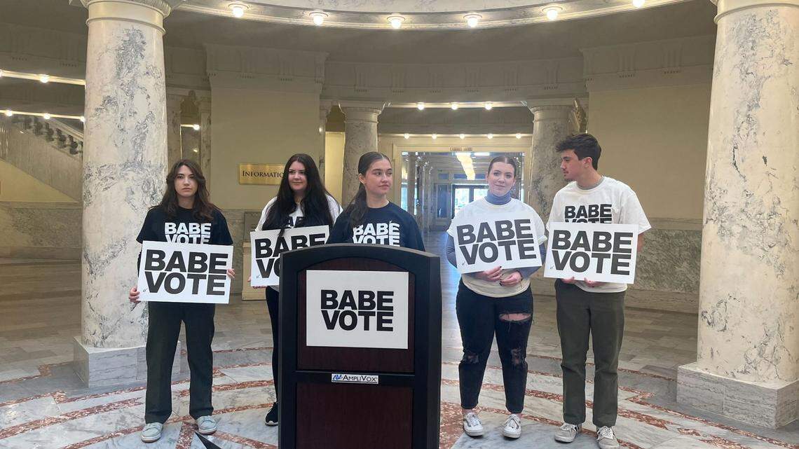 Supporters of BABE Vote, a student activist group, gathered at the Idaho Capitol on Friday, March 17, 2023, announcing a lawsuit to fight a new law that bans students from using student IDs to vote.