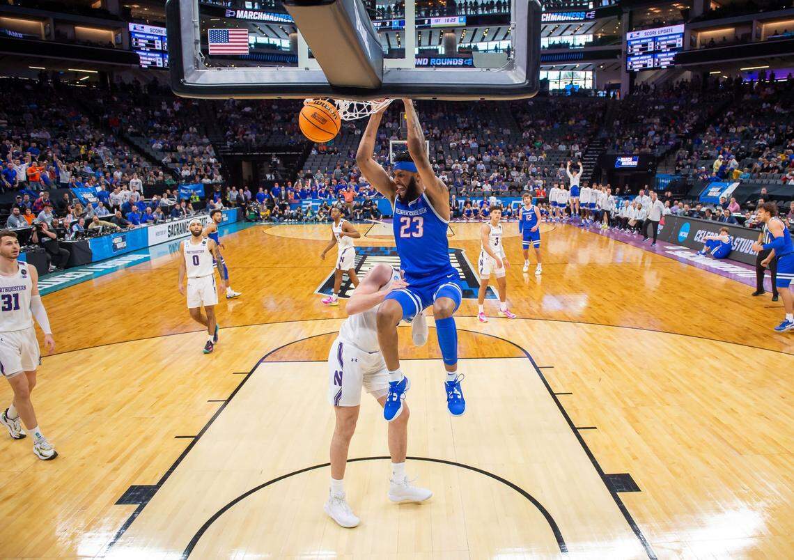 Boise State Broncos forward Naje Smith dunks the ball over Northwestern Wildcats center Matthew Nicholson during the first half of the NCAA Tournament on Thursday at Golden 1 Center.