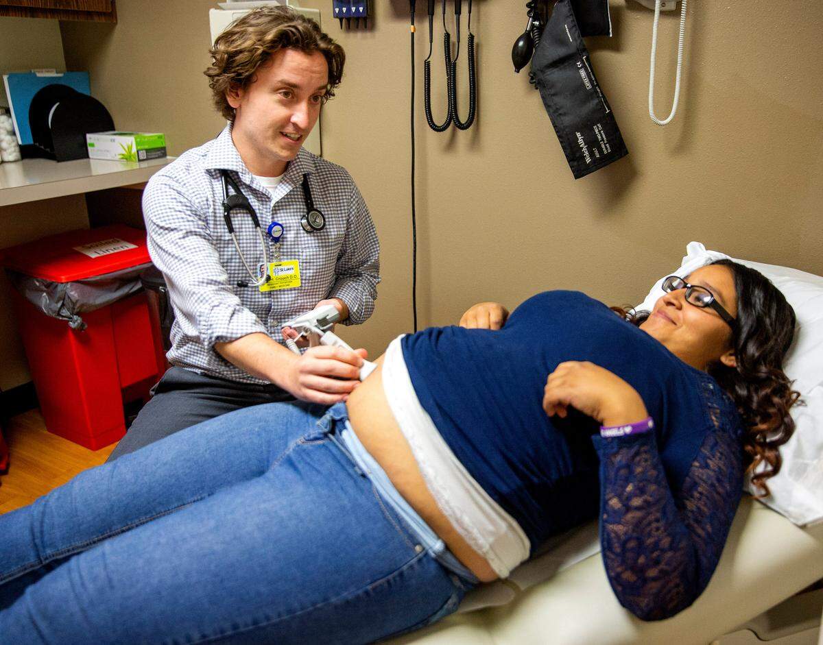 Dr. Robert Crouch listens to the heart rate during Jessalynna Camayo's pregnancy checkup May 17, 2018, at St. Luke's Jerome clinic.