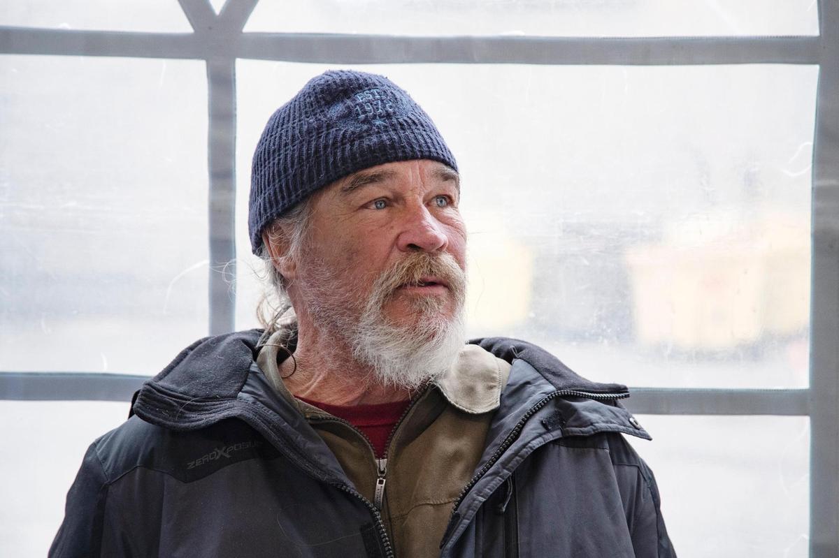 Randy Saintero spends time in a large, heated tent on the Interfaith Sanctuary property on Tuesday. Saintero said he is experiencing homelessness for the first time.