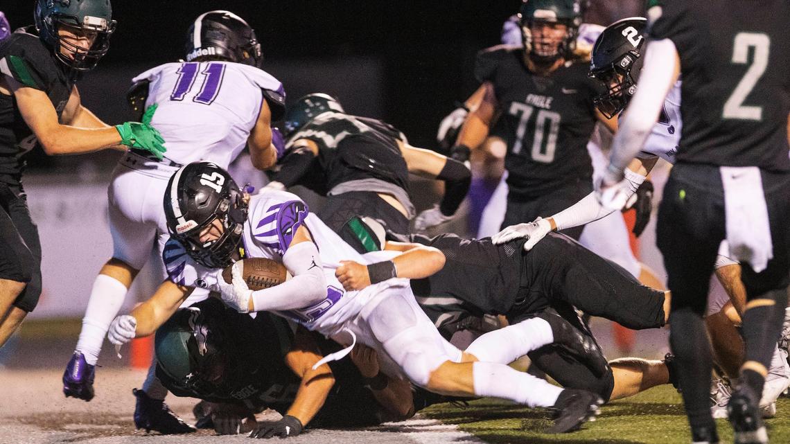 Rocky Mountain’s Art Williams plows ahead for one of his three touchdowns Friday at Eagle.