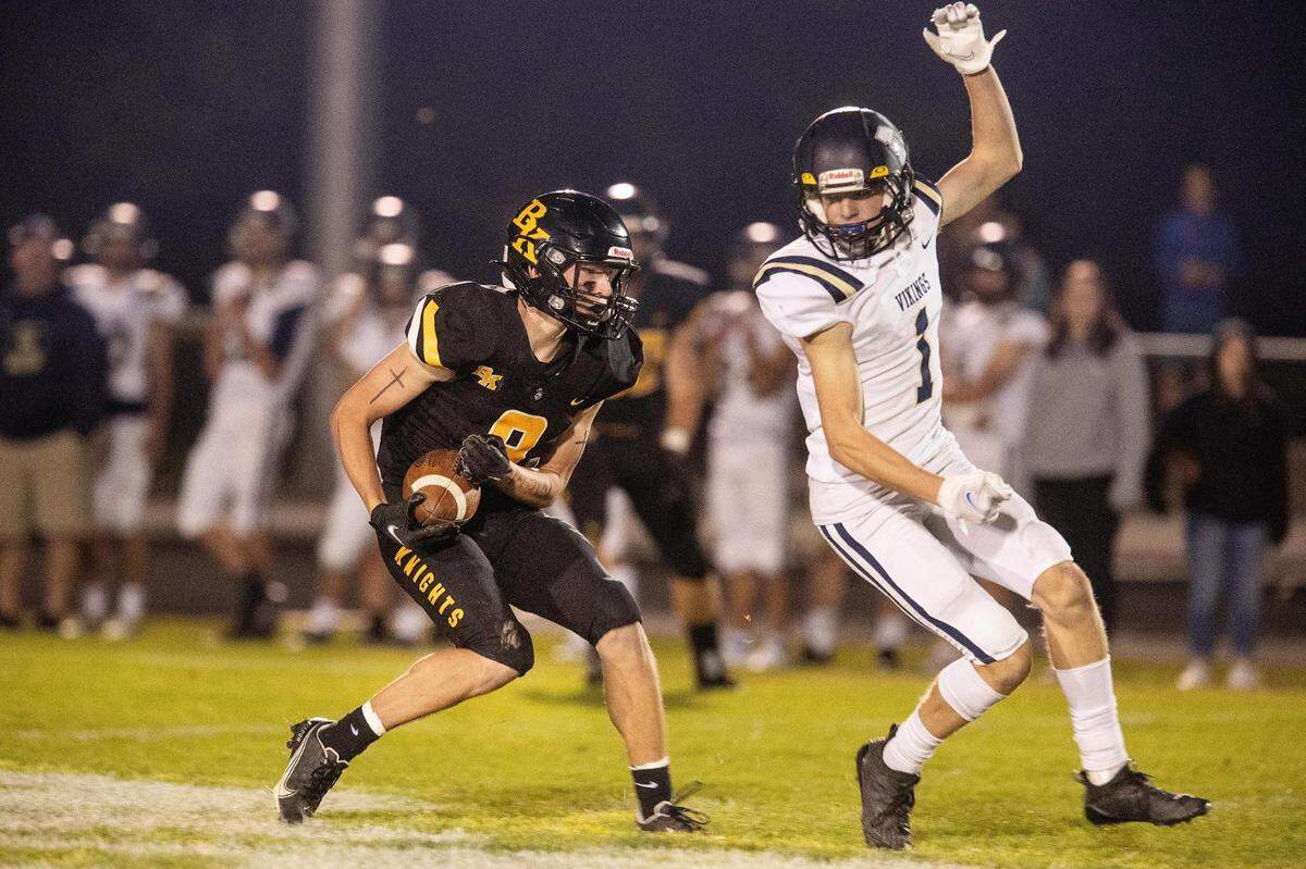 Bishop Kelly’s Jacob Lukasik intercepts a pass intended for Middleton wide receiver Owen Garviet on Oct. 1. The Knights hit the road to face Pocatello in the 4A state quarterfinals Friday.