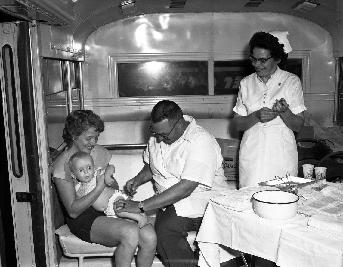 Dr. C.R. Blackburn gives a polio vaccine to a young child as part of an Idaho Department of Health program to inoculate the state’s youth against the deadly disease.