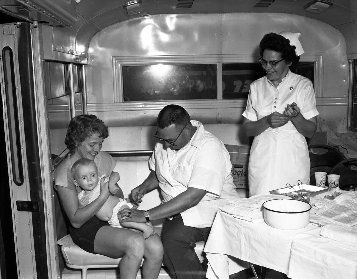 Dr. C.R. Blackburn gives a polio vaccine to a young child as part of an Idaho Department of Health program to inoculate the state’s youth against the deadly disease.