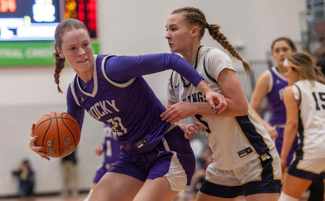 Rocky Mountain senior Anna DaBell, left, fights off pressure from Middleton sophomore Miley Steele during the 5A District Three Tournament semifinals Feb. 3 at Owyhee.