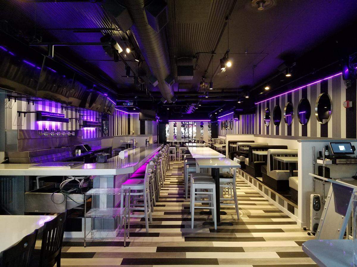 The interior of Union Block Bar & Eatery is sleek, but the layout will be familiar to former Old Chicago patrons.