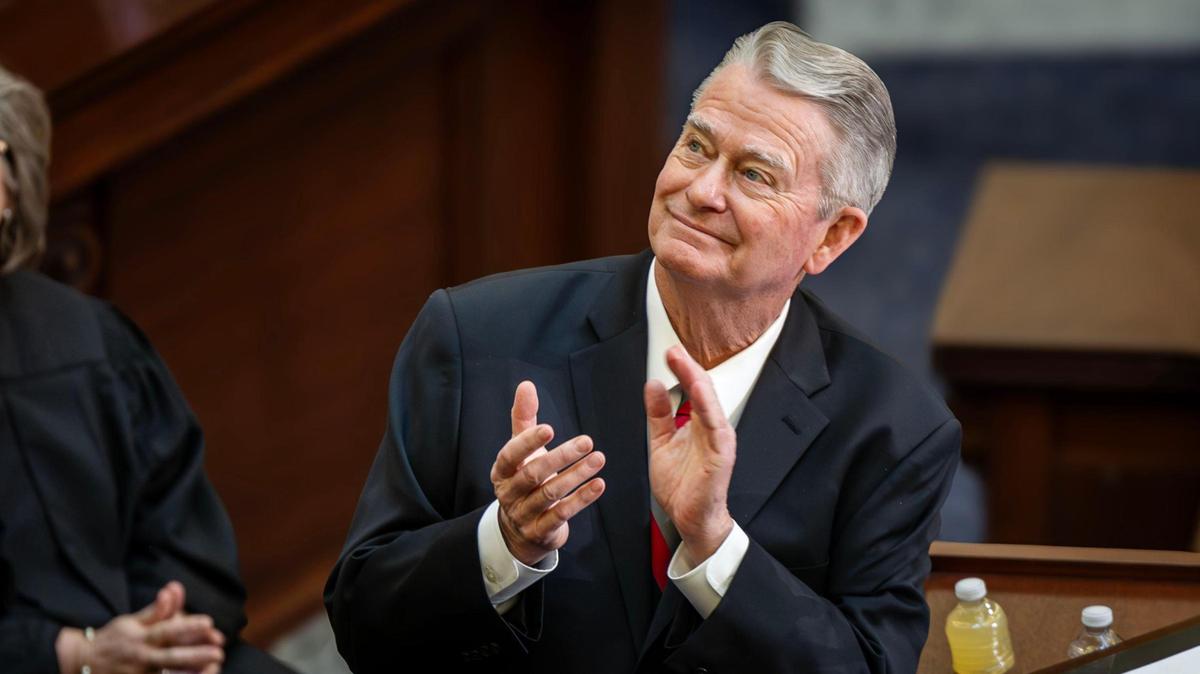 Idaho Gov. Brad Little applauds an Idaho State Police trooper during his State of the State address Monday to kick off the legislative session.