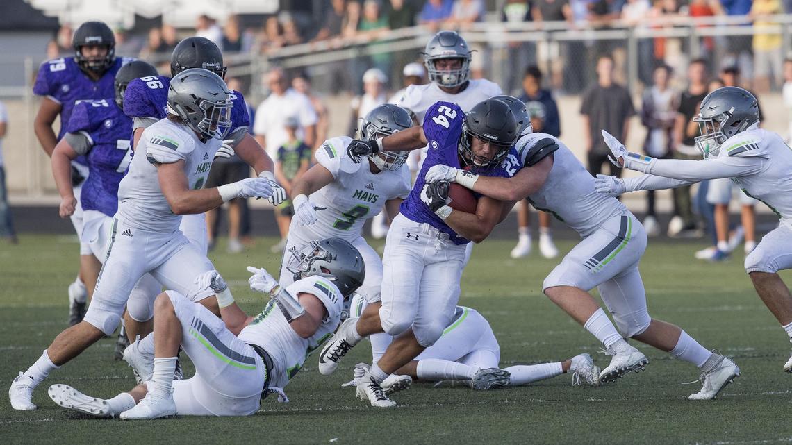 Rocky Mountain running back Nick Romano plows through Mountain View’s defense for 20 yards before being brought down in a game at Rocky Mountain High in Meridian.