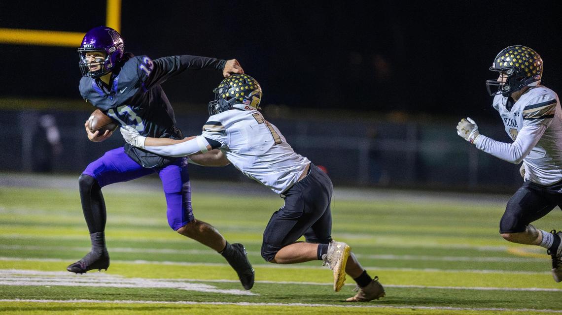 Kuna linebacker Christopher Pollard chases down Rocky Mountain quarterback Austin Rovig in the first quarter Friday. Rovig finished 8-for-16 for 122 yards and a touchdown.